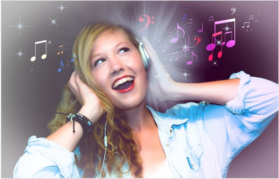 a woman listening to music singing