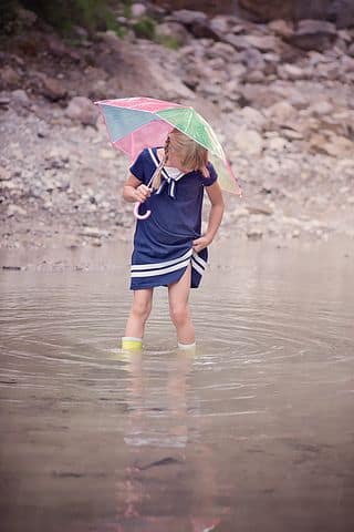 girl playing in river